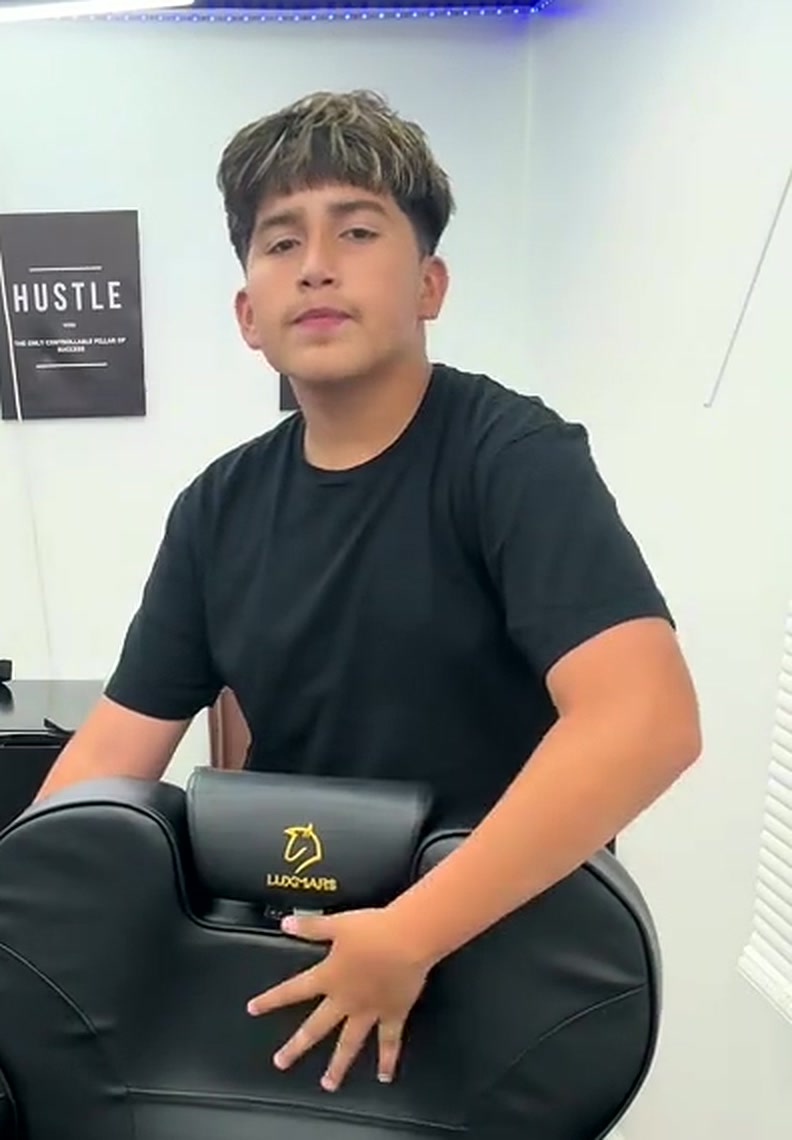 Brian Pina, barber at Elite Fadez, in his shop